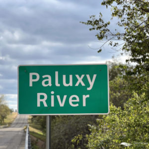 Highway sign for Paluxy River on the road while out Fly Fishing in North Texas